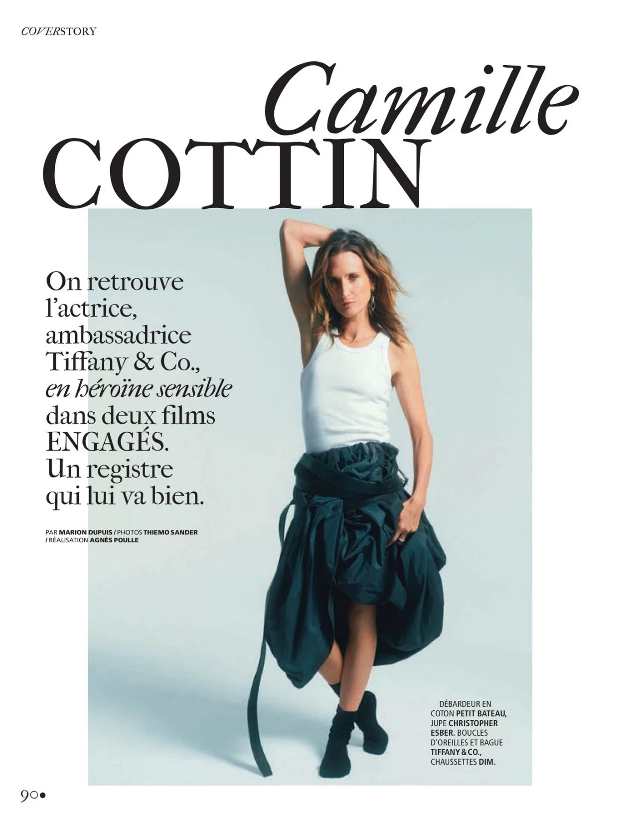 Camille Cottin wearing white tank top and dark voluminous skirt in studio portrait