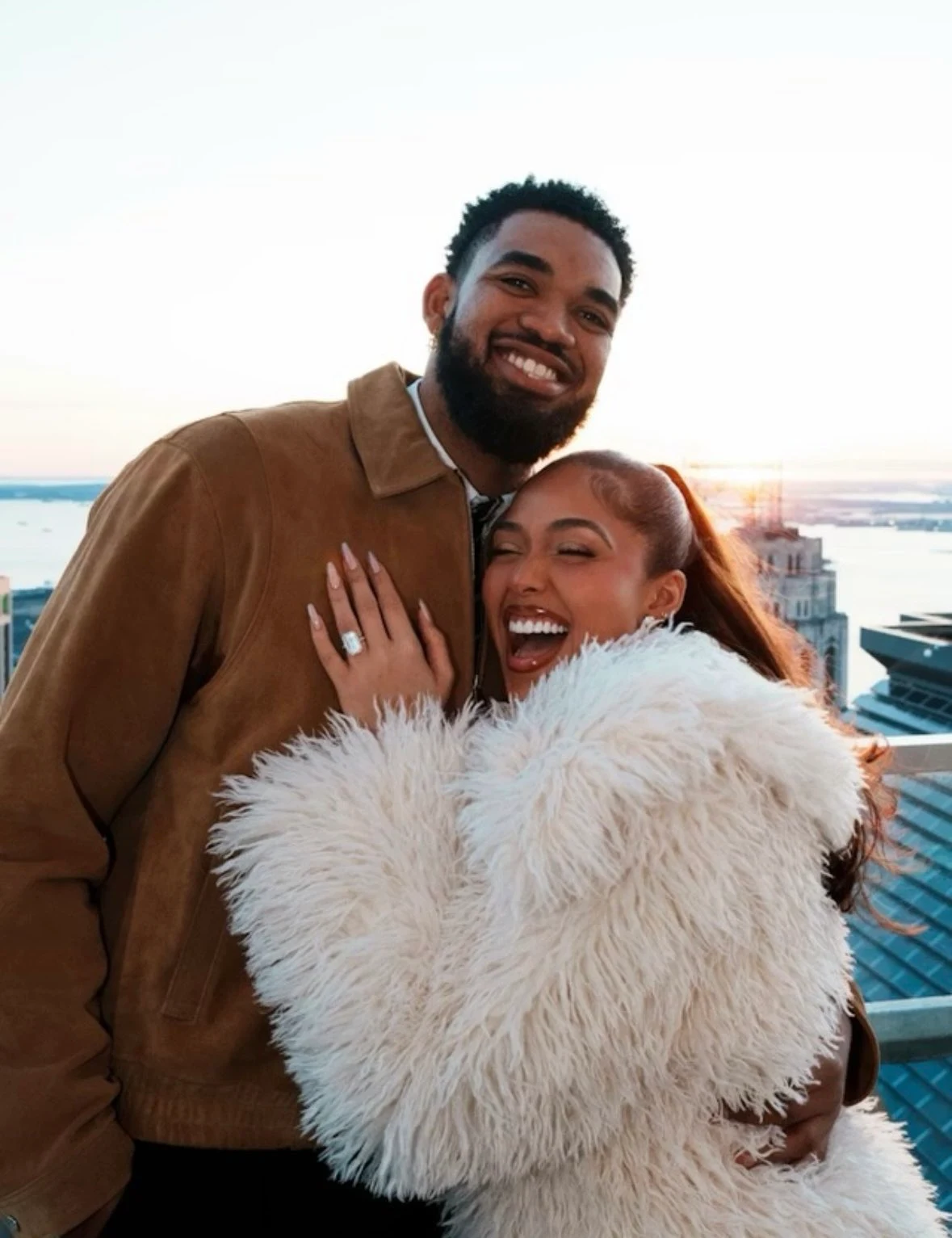 Karl-Anthony Towns in a brown suede jacket and tie during his engagement proposal to Jordyn Woods.