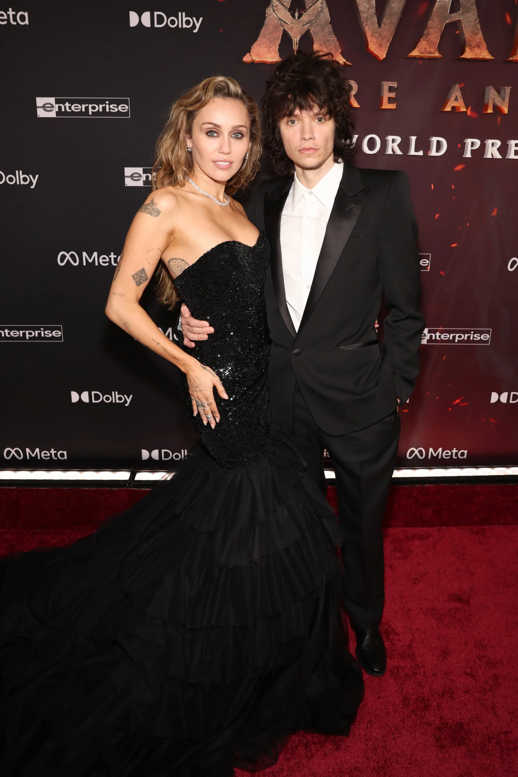 Miley Cyrus in elegant black sequin strapless Gucci dress at Avatar: Fire and Ash premiere