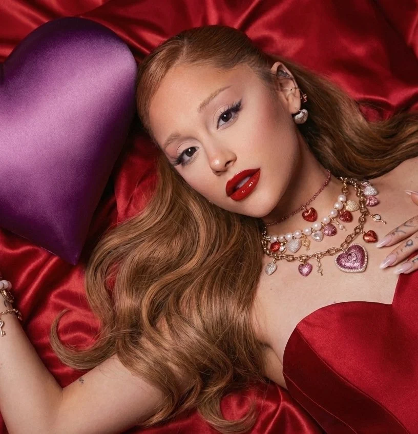 Ariana Grande with striking red lips and crystal heart jewelry in Swarovski's campaign