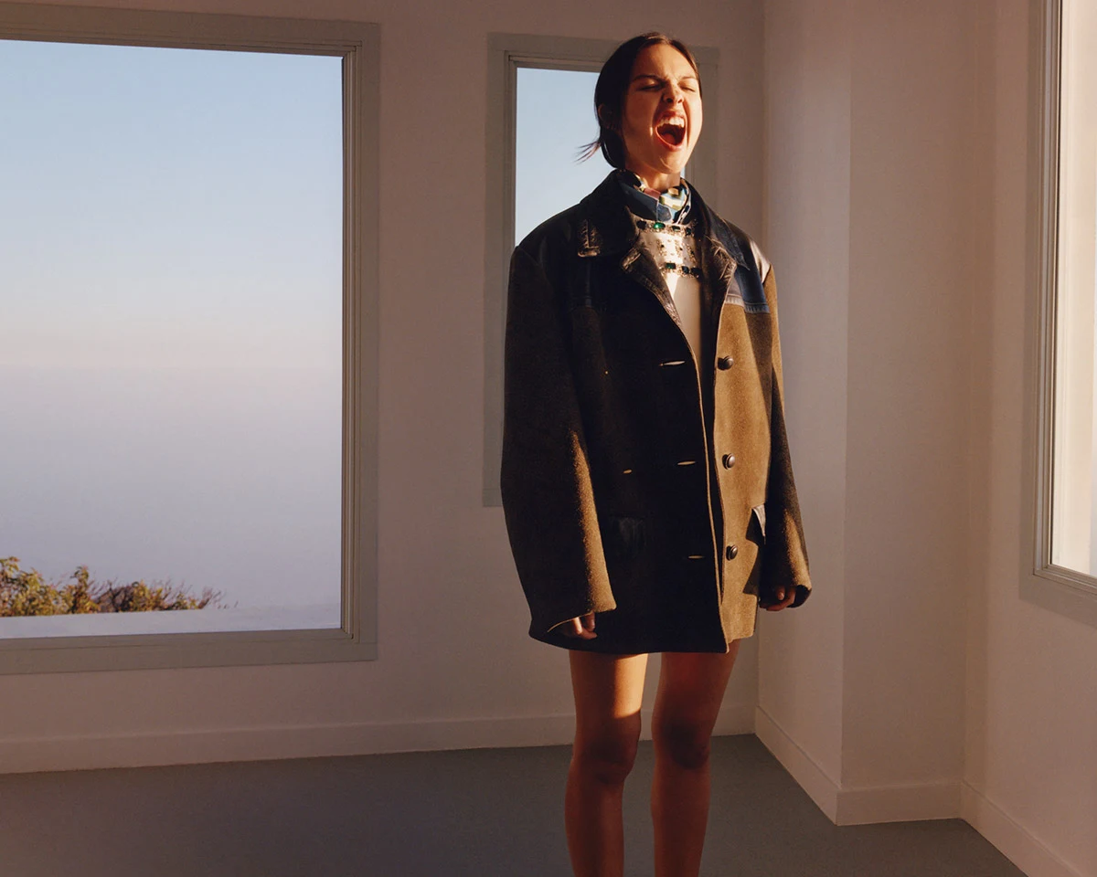 Olivia Rodrigo wearing an oversized leather coat in the Miu Miu Spring 2026 campaign