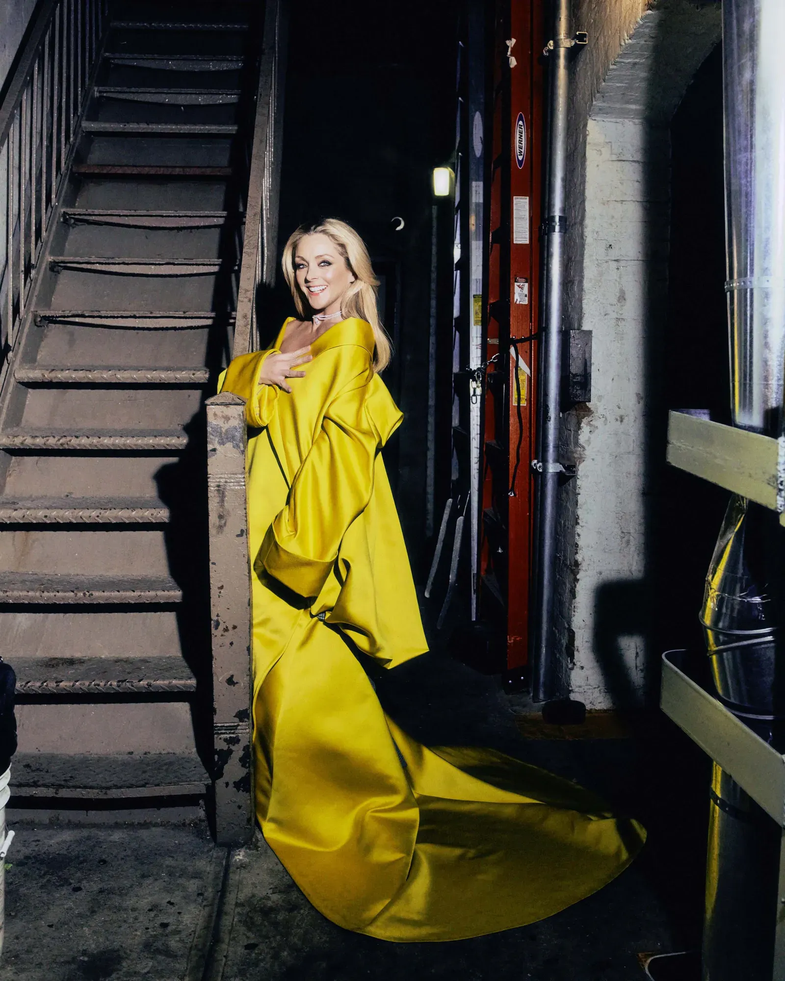 Jane Krakowski wearing a Bach Mai coat with a statement necklace for Vogue