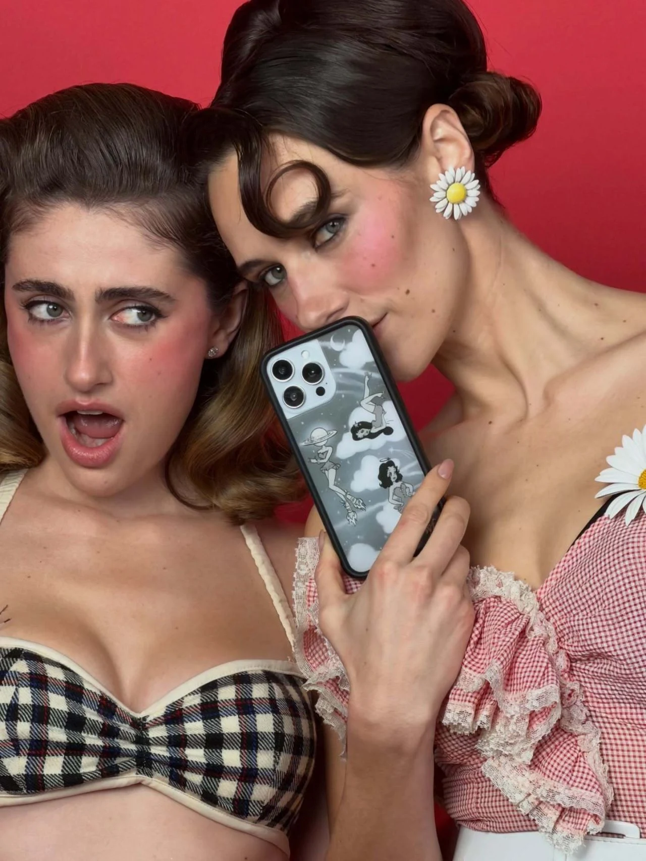 Rachel Sennott holding a smartphone with a patterned Wildflower phone case in campaign shoot