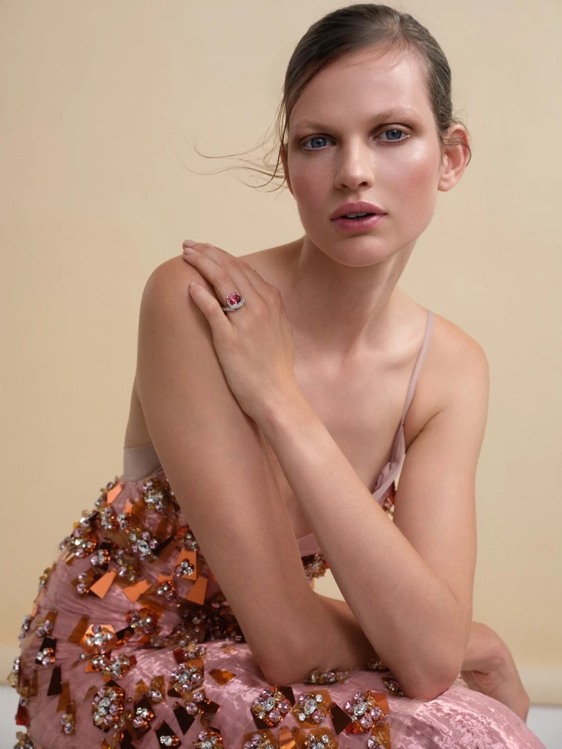 Bette Franke posing in festive Dior party look with ruby cocktail ring