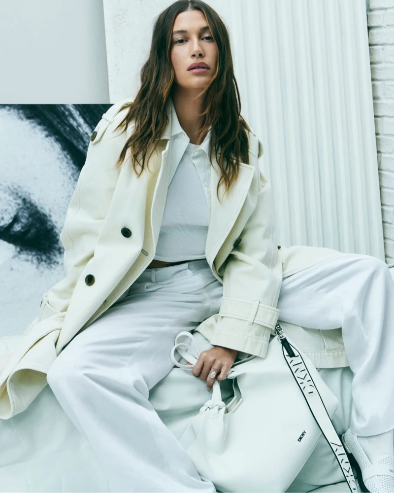 Hailey Bieber wearing cream trench coat DKNY