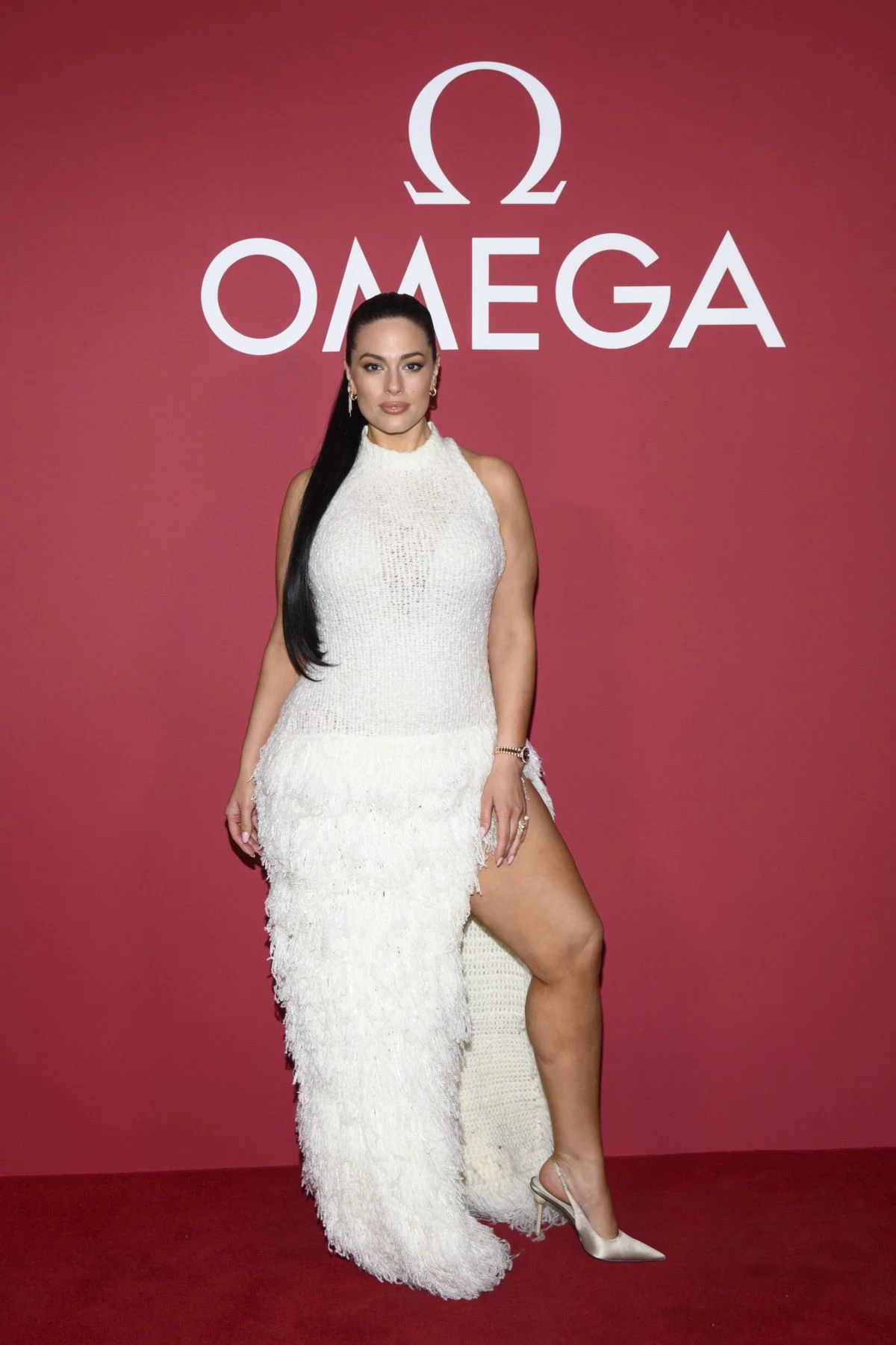 Ashley Graham white knitted gown Omega party Milan