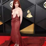 Chappell Roan at Grammys 2026 wearing sheer burgundy Mugler gown