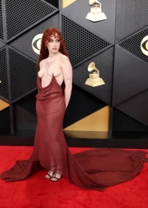 Chappell Roan at Grammys 2026 wearing sheer burgundy Mugler gown