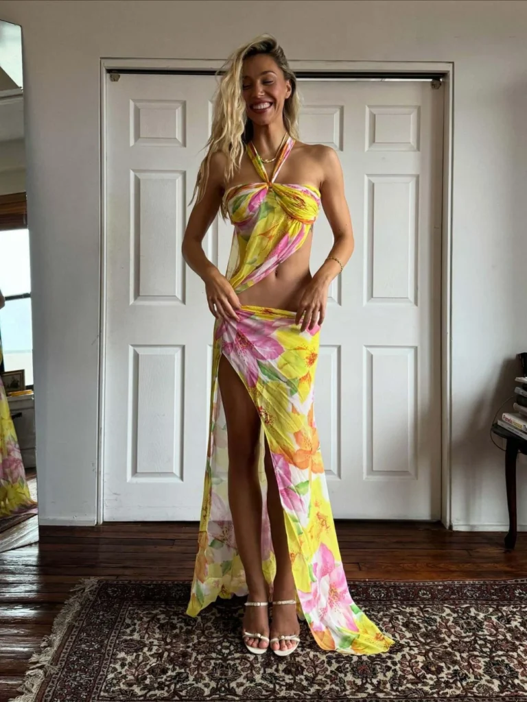 Alexis Ren in floral halter dress with high slit for Mirror Palais October 2025 shoot