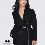 Jenna Ortega in black belted blazer and shorts for Grazia UK January 2026