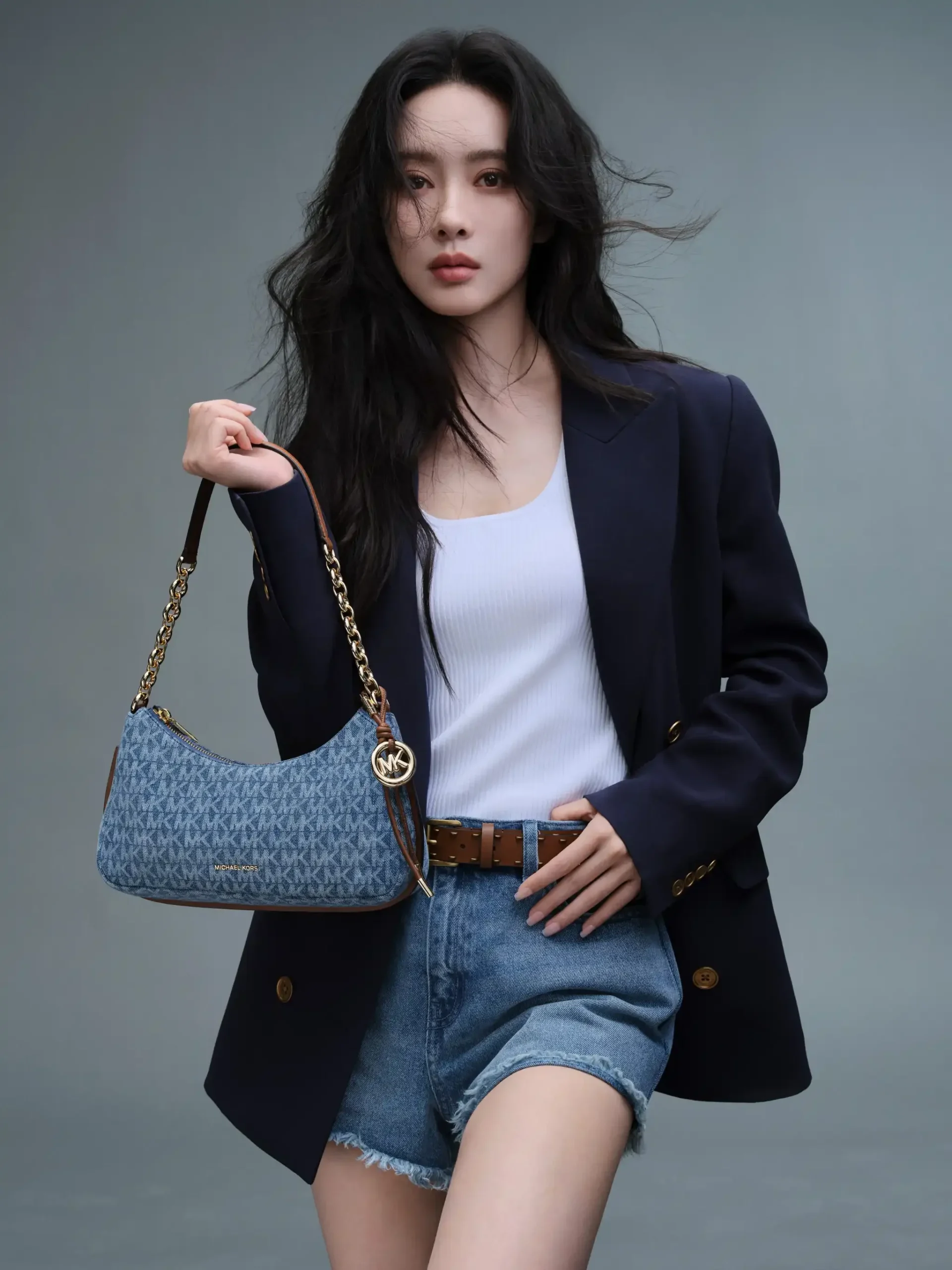 Meng Ziyi carrying Michael Kors Nolita pochette denim logo