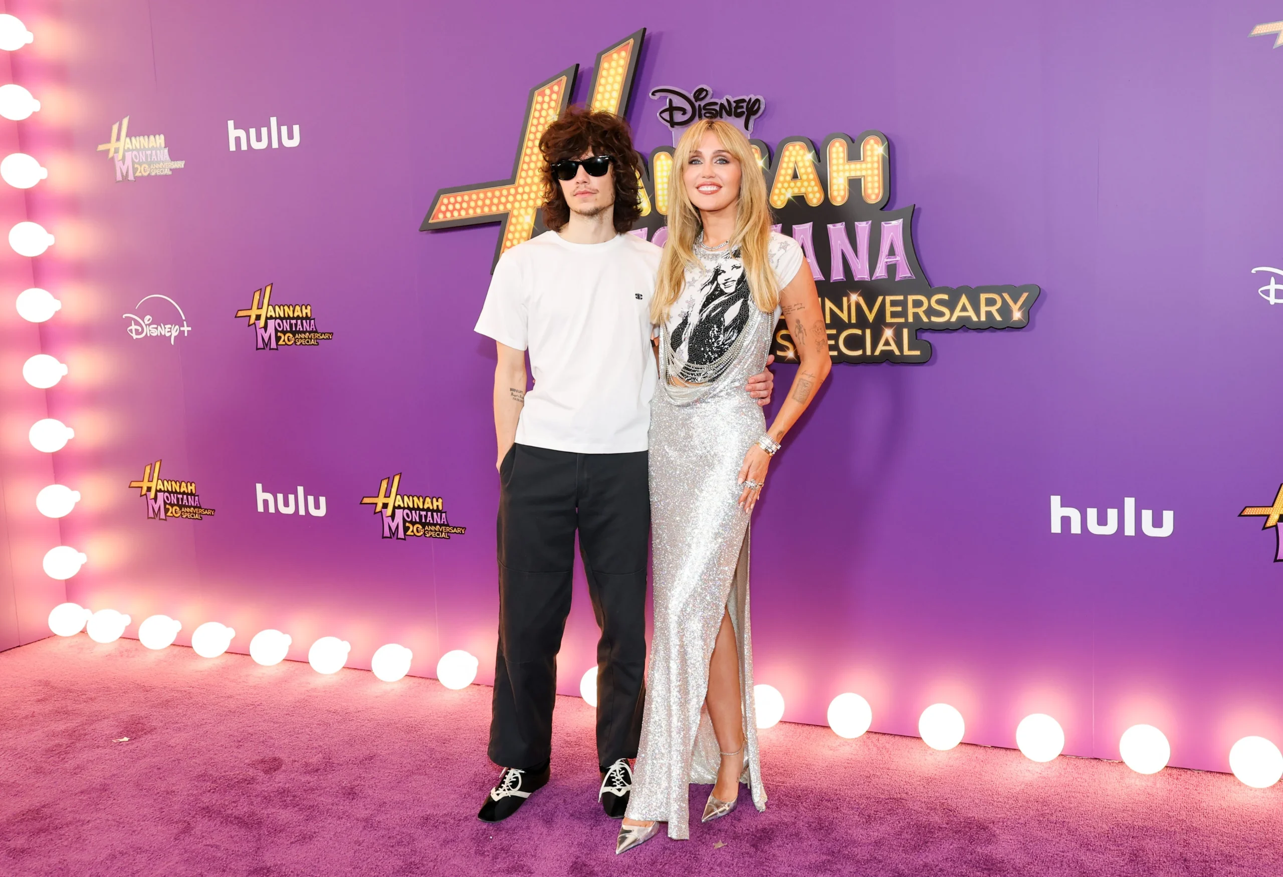 Miley Cyrus Maxx Morando red carpet Hannah Montana 20th anniversary