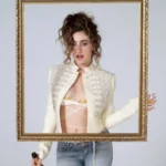 Rachel Sennott wearing an ivory cropped military-style jacket with wrap bralette and light-wash jeans for Perfect Magazine.