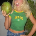 Sabrina Carpenter green Brasil baby tee outfit March 2026