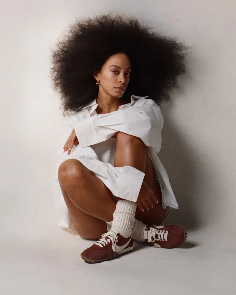 Solange wearing Nike Jacquemus Moon Shoes with white shirt